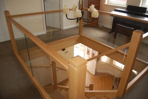 Polished oak Timber and Glass Staircase landing Irvine