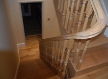 Timber staircase with curved handrails
